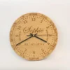 Handmade oak learning clock with engraved numbers, shown with black clock hands. A personalised wooden wall clock ideal for teaching children to tell the time.