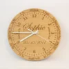 Handmade oak learning clock with engraved numbers, shown with black clock hands. A personalised wooden wall clock ideal for teaching children to tell the time.